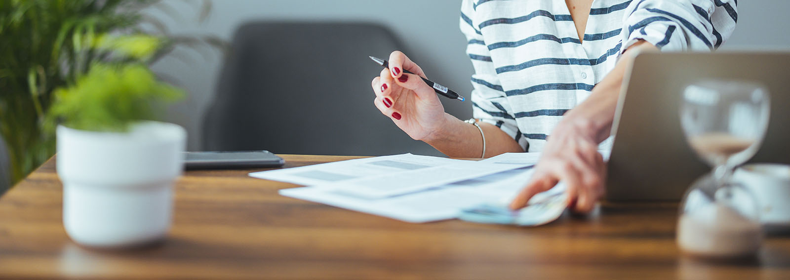 Doctor reviewing documents in her office