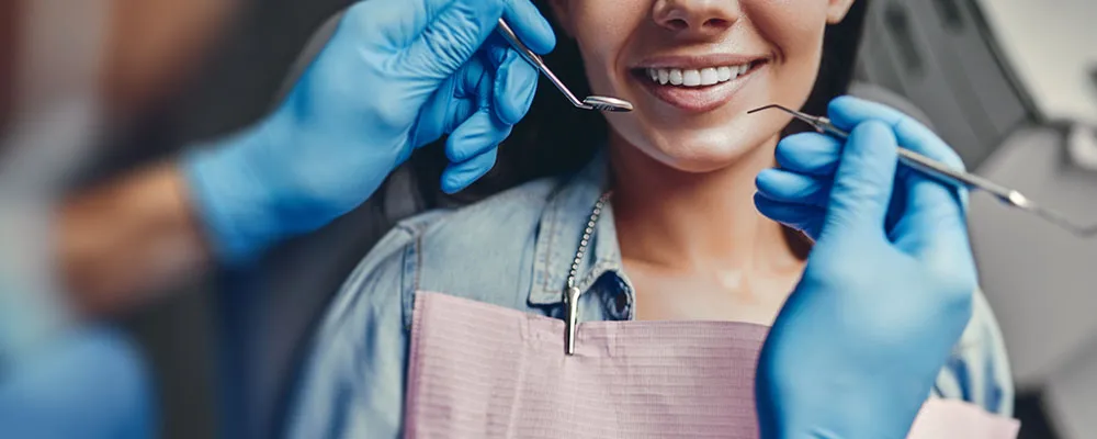 Dentist working on woman's teeth