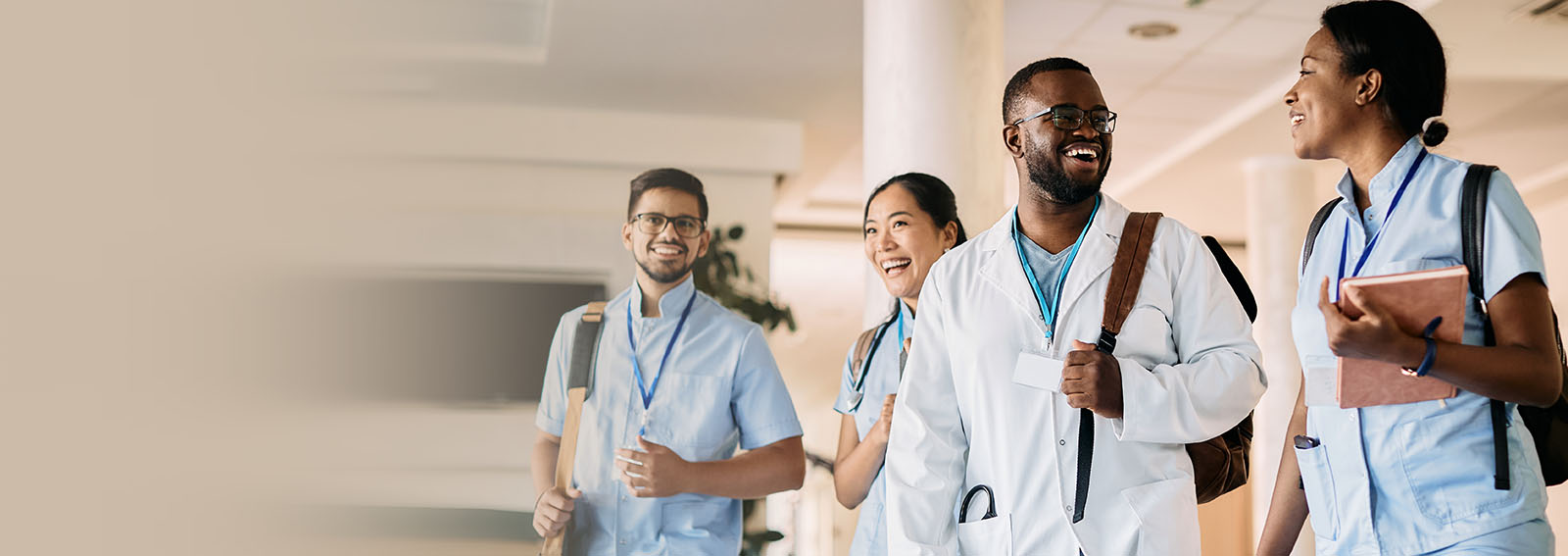 smiling healthcare students walking and having a conversation