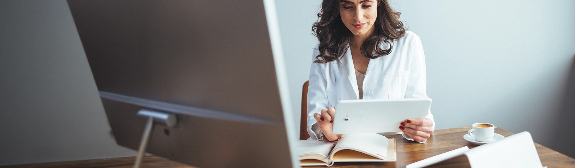 Doctor working on a tablet in her office
