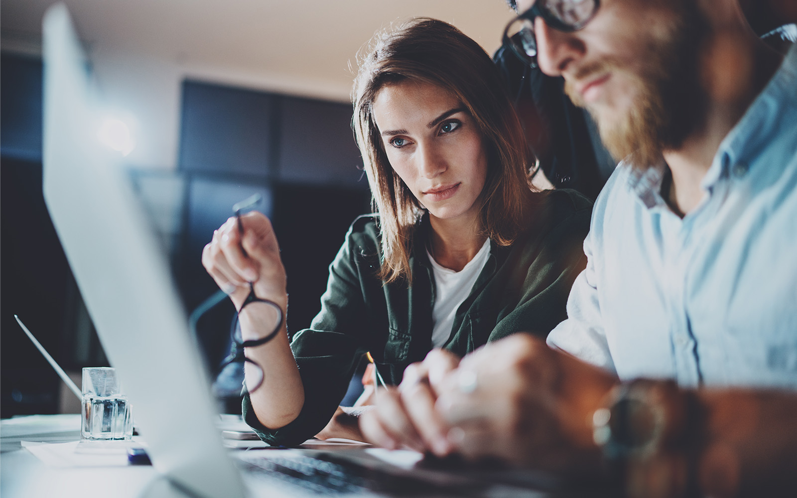 Two people looking at a computer