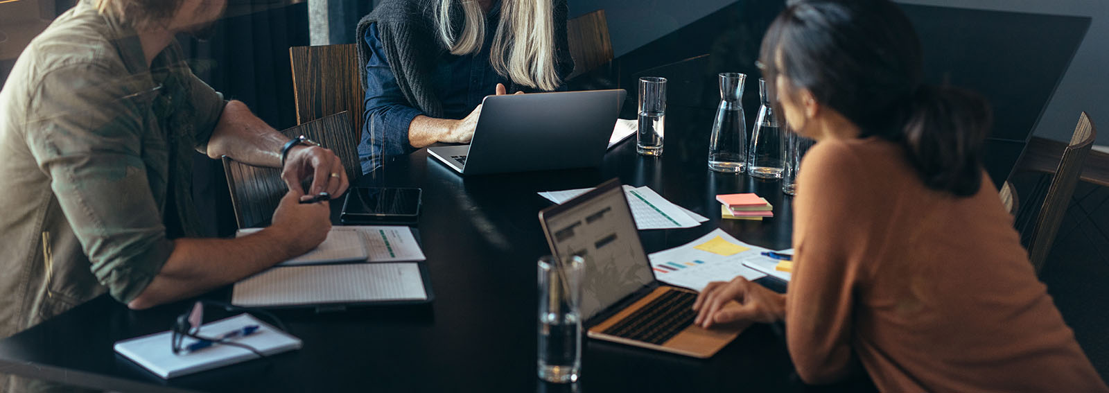 professionals sitting around a table discussing their succession plan