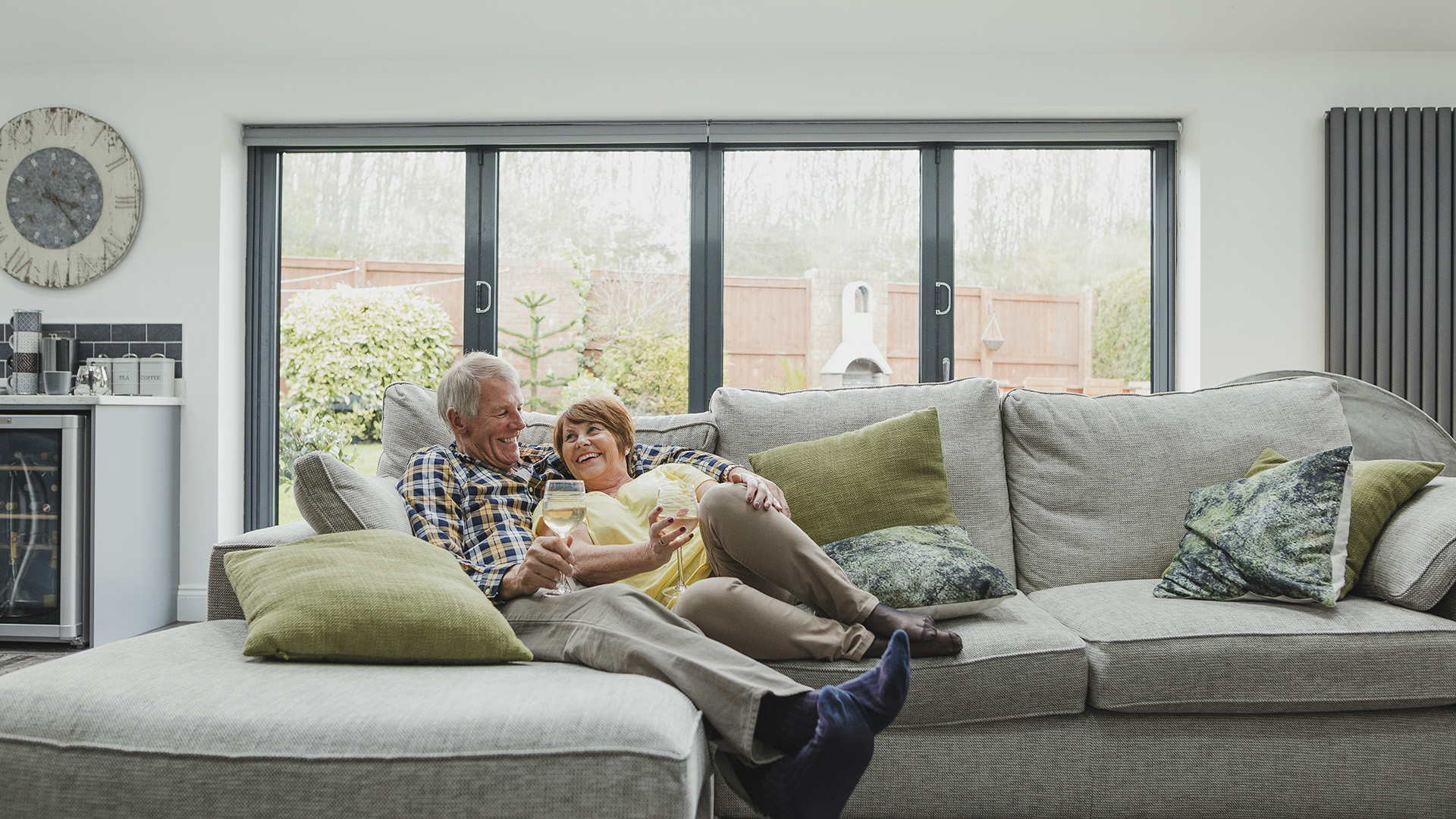 Older couple sitting in their cozy living room