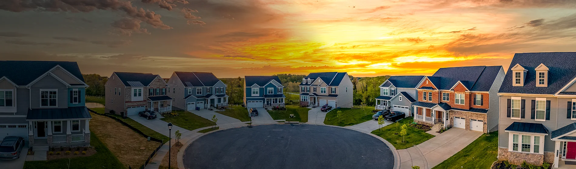 Residential cul de sac with colorful sunset sky