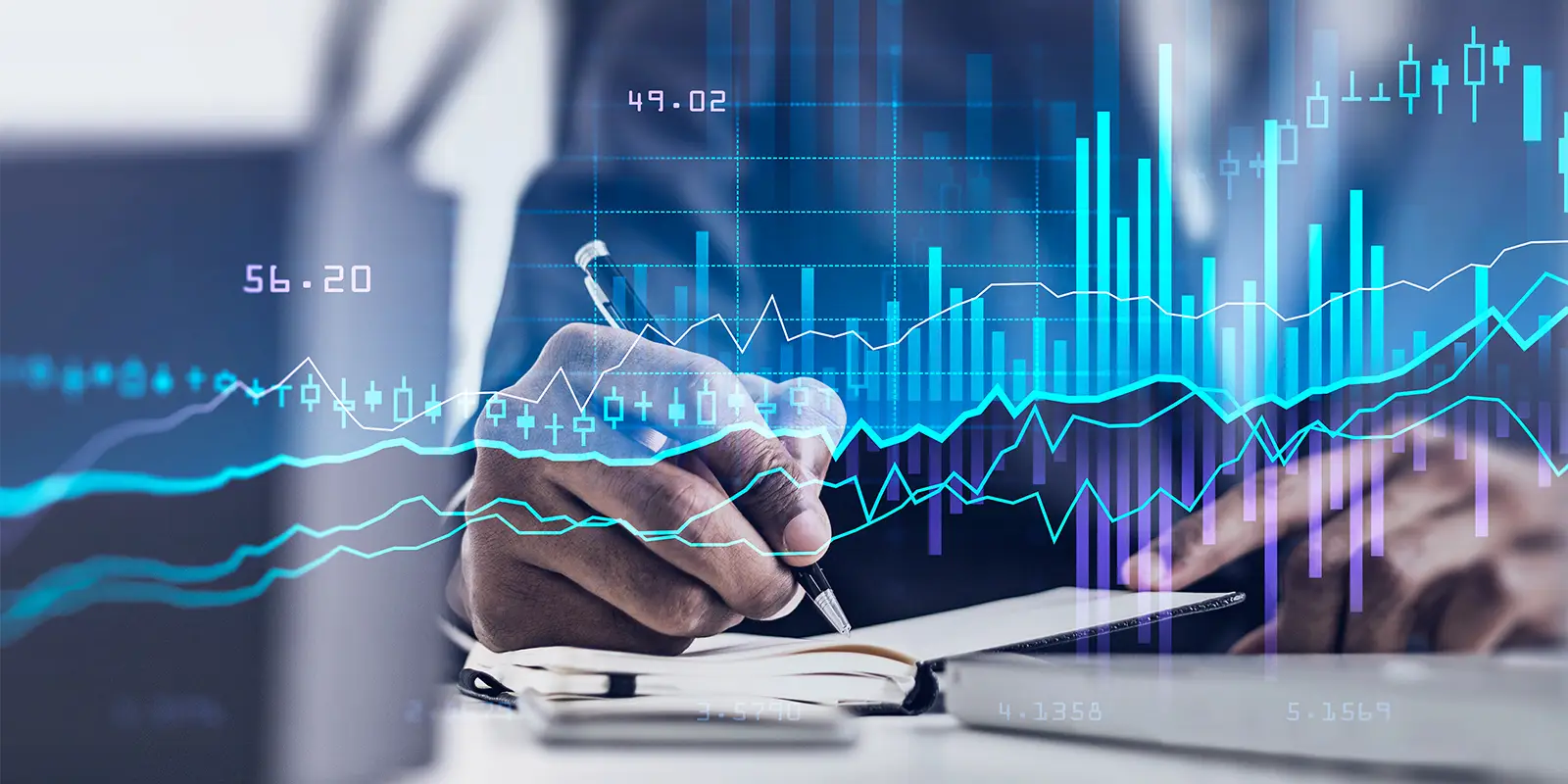 Businessman hand with pen writing in notebook laptop on the table and double exposure of rising char