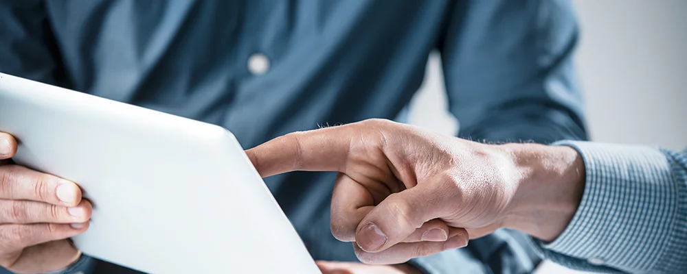 Man pointing at a document at work