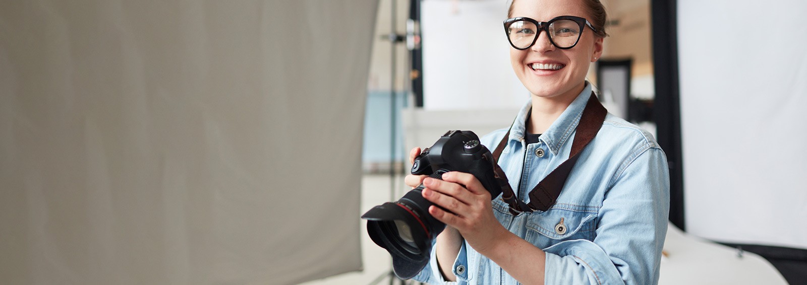 happy photographer in a modern studio