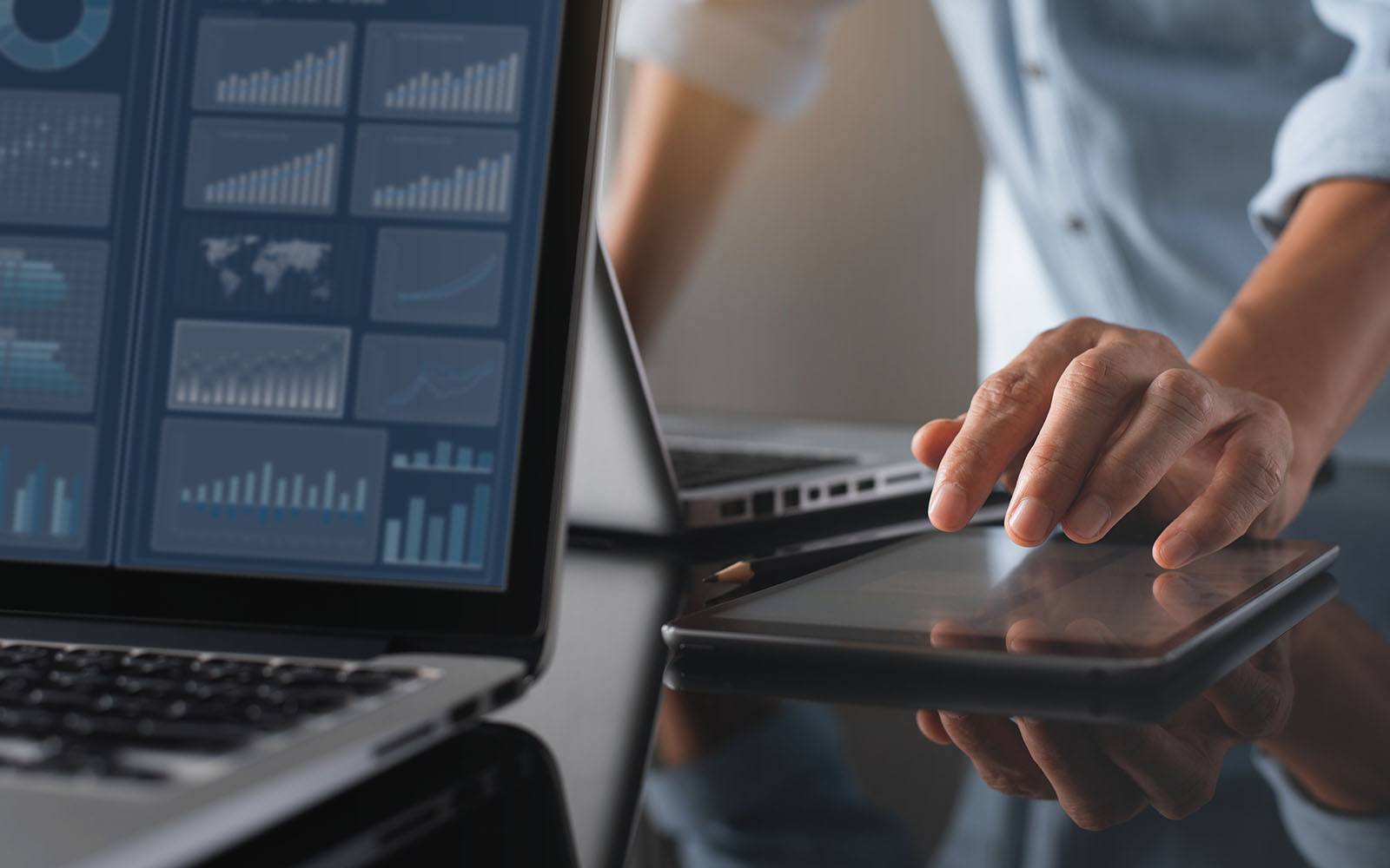 Businessman analyzing data while monitoring a dashboard