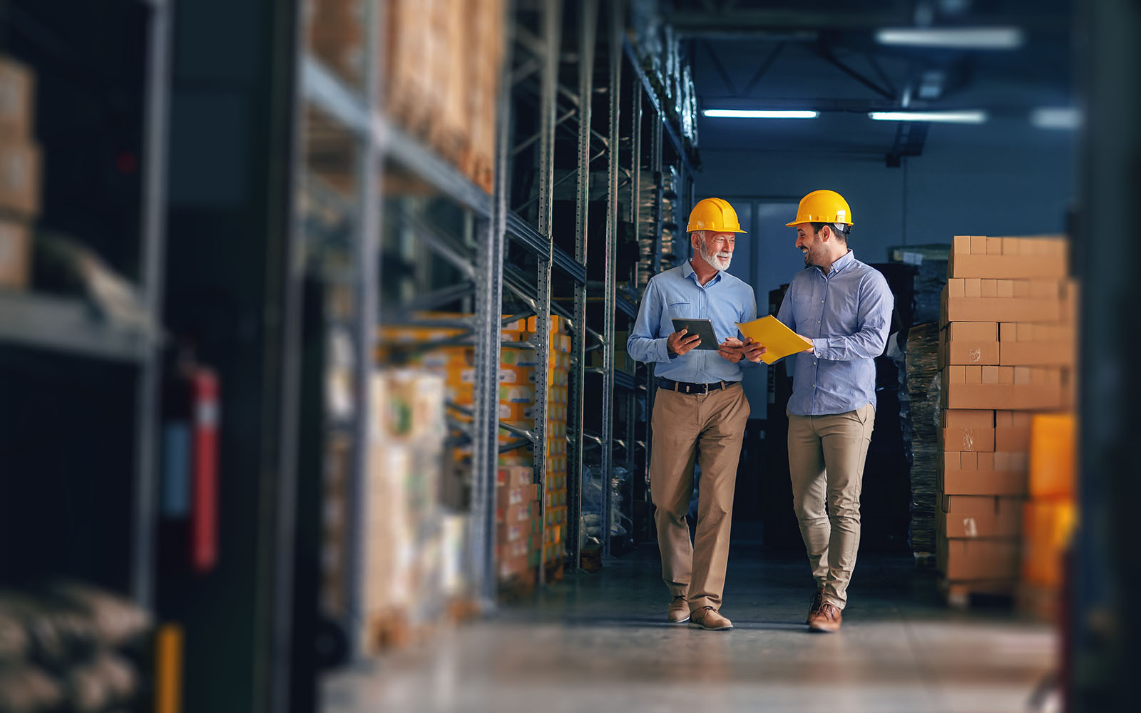 Two partners walking through a warehouse