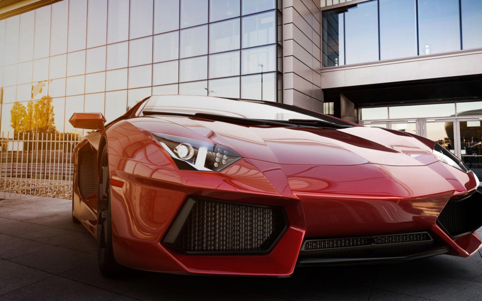 red sports car parked outside building