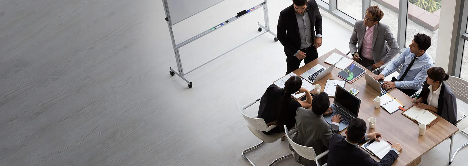 Aerial view of group of business people working in an office.