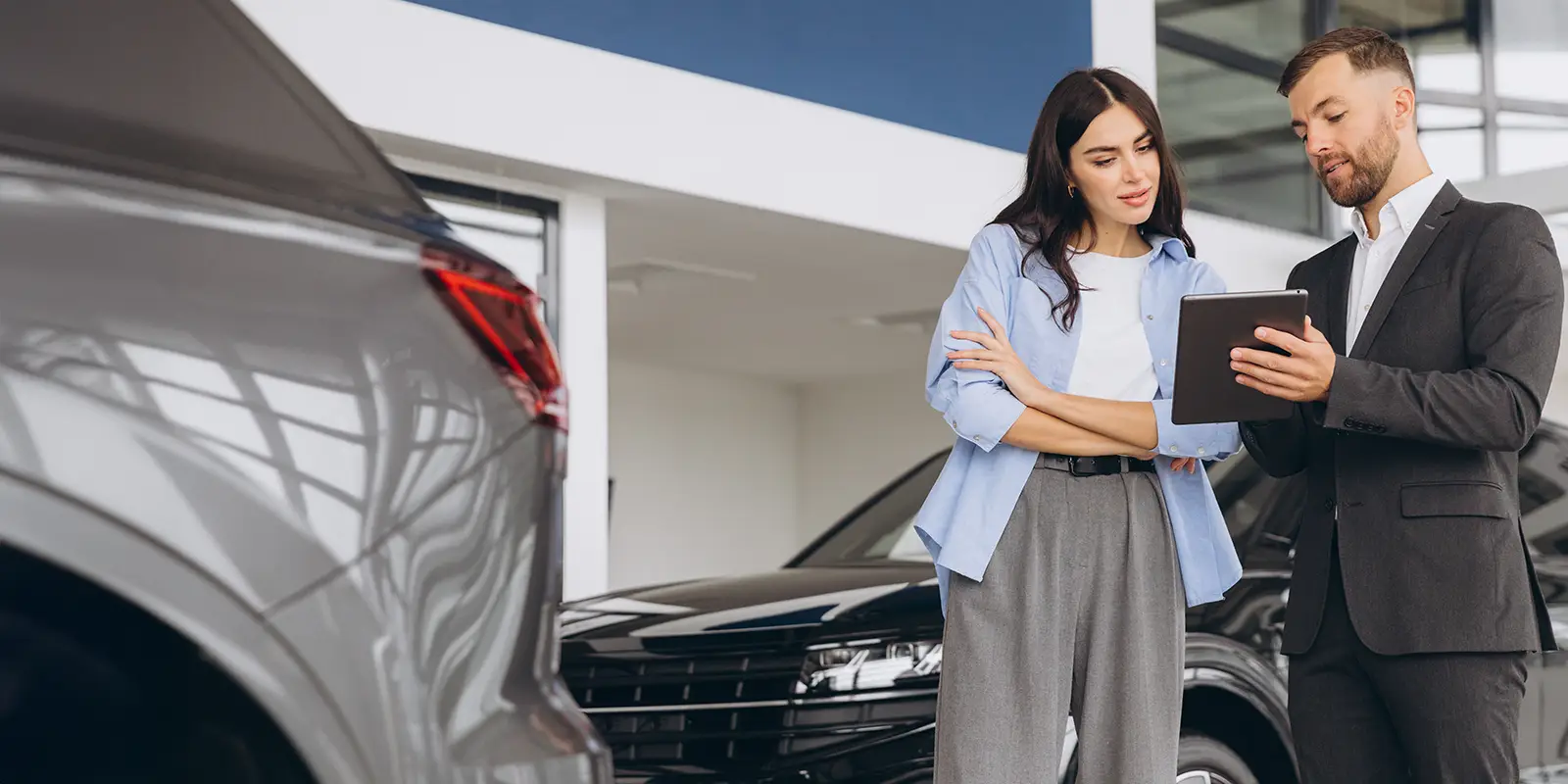female buyer client consults with salesman hold tablet