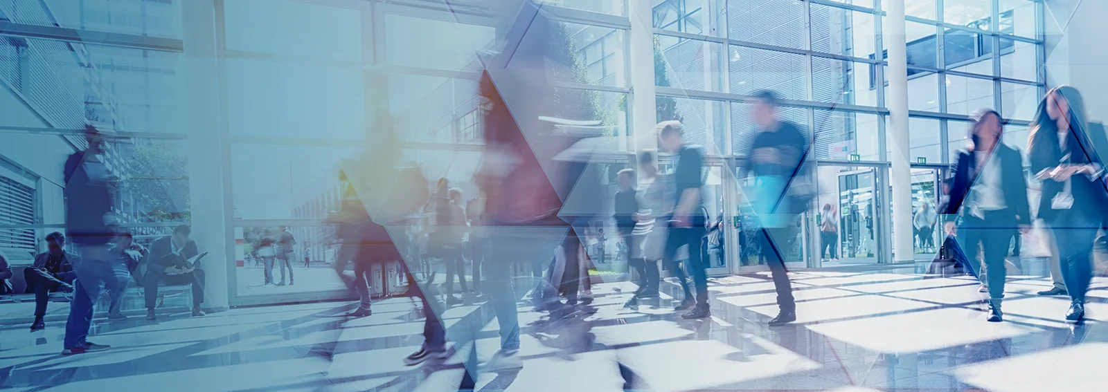 people walking and talking in a modern office