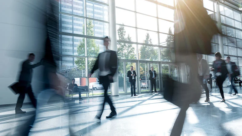 Office lobby with people walking