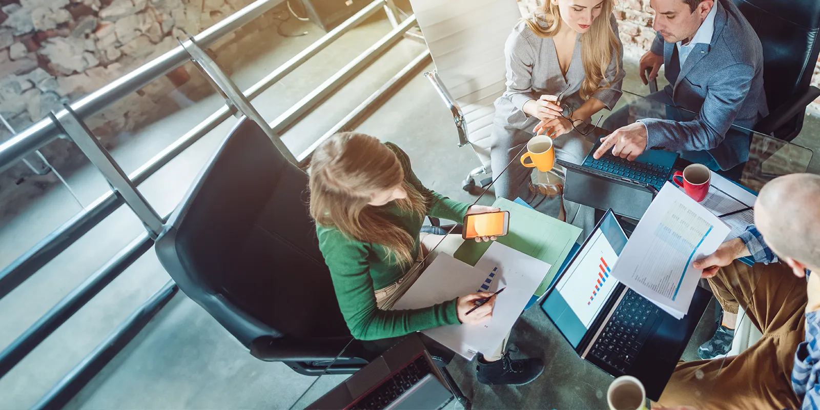 Business team evaulating documents in a modern office