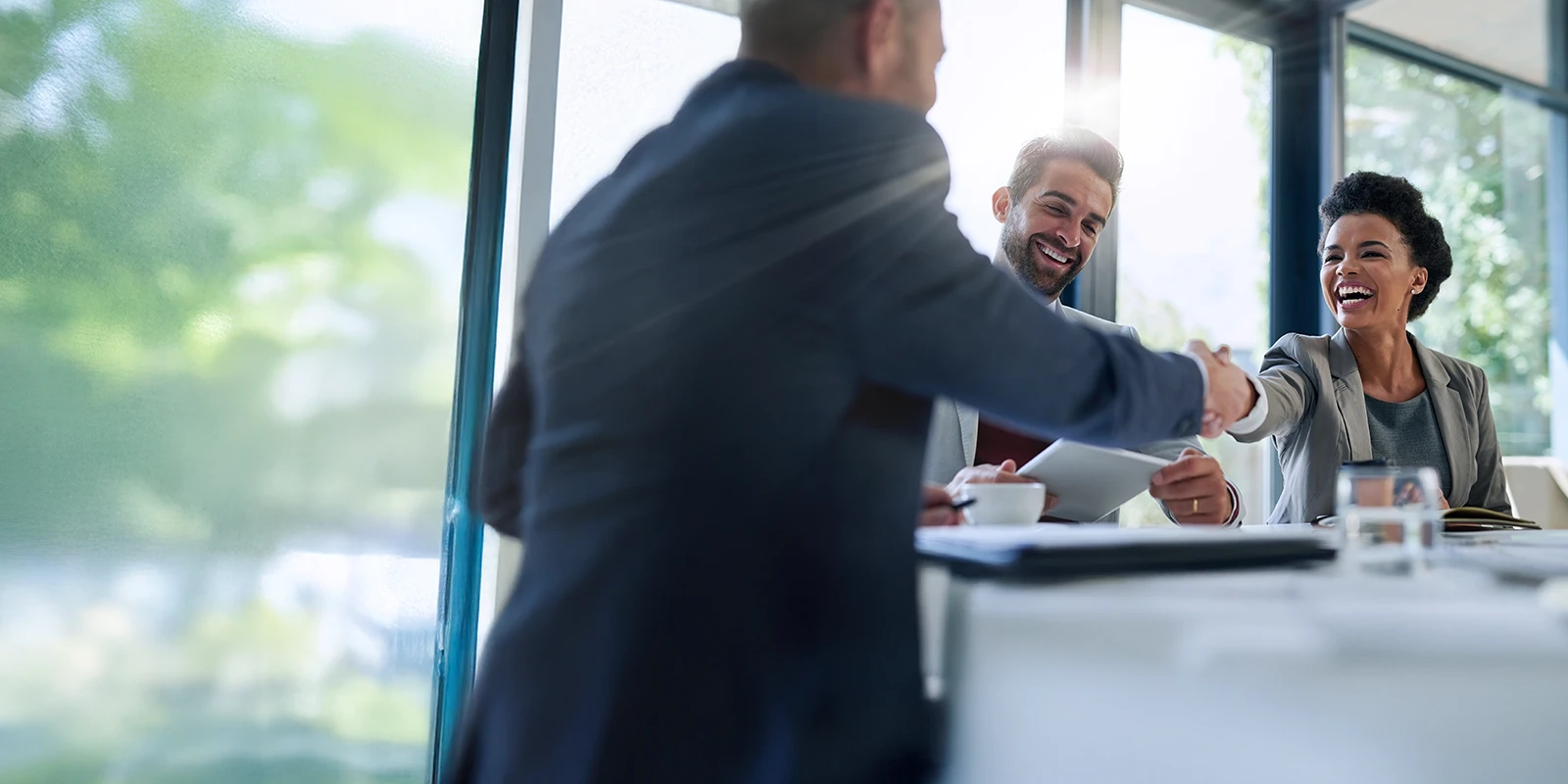 Business team shaking on a transaction