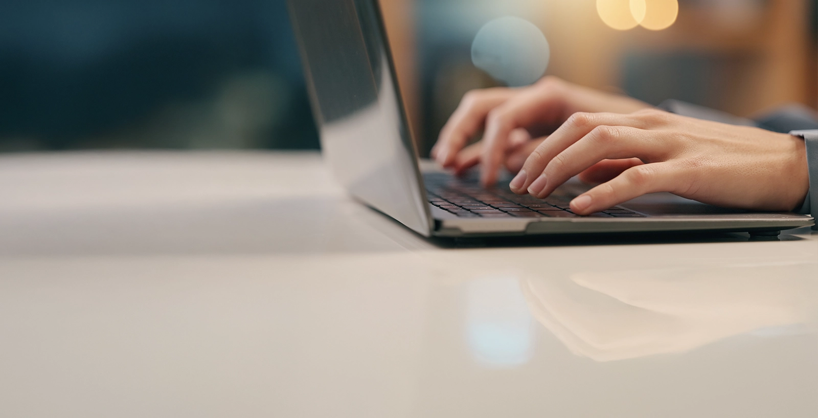 Person typing on laptop