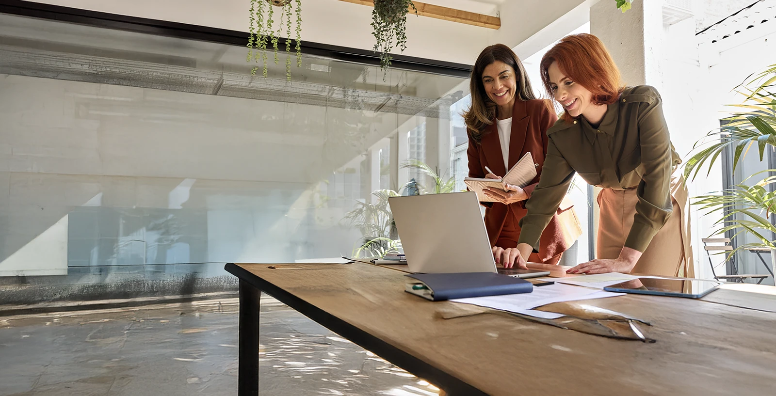 business team collaborating on a laptop