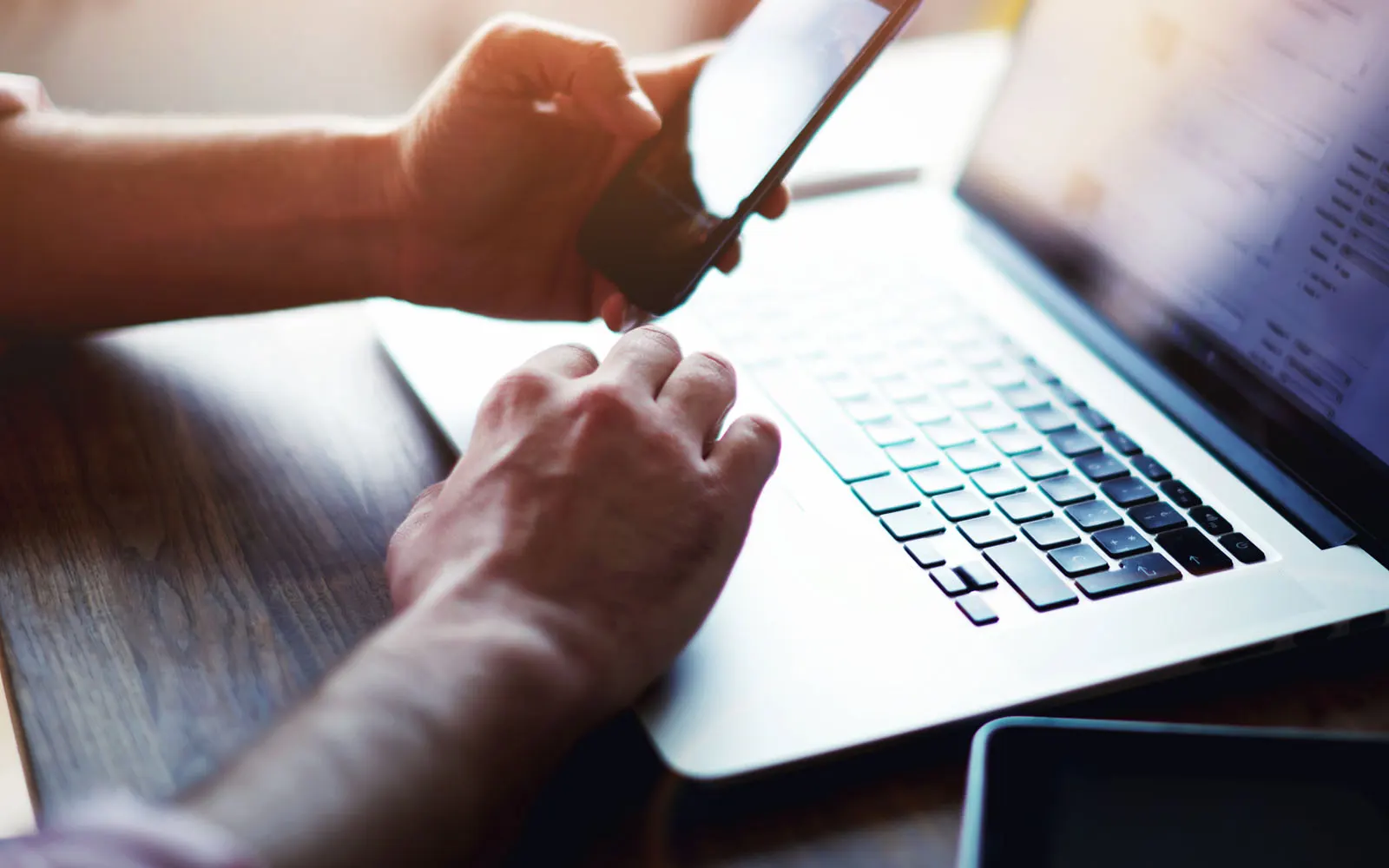 person working on bookkeeping on their laptop