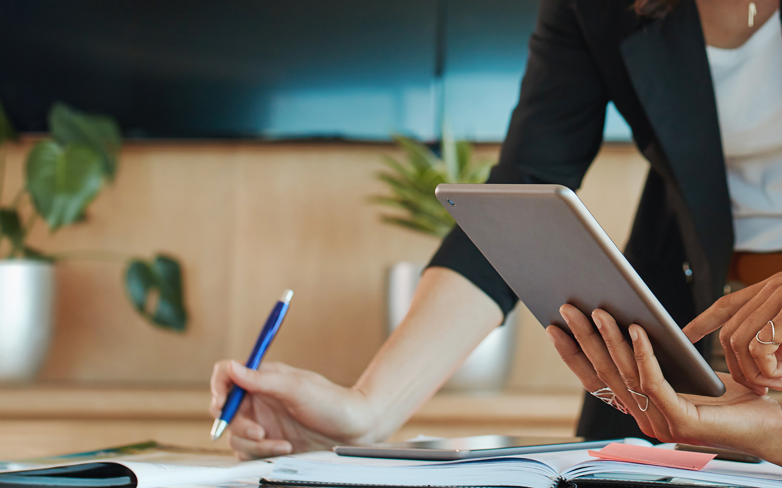 Business women reviewing accounting and bookkeeping on a tablet