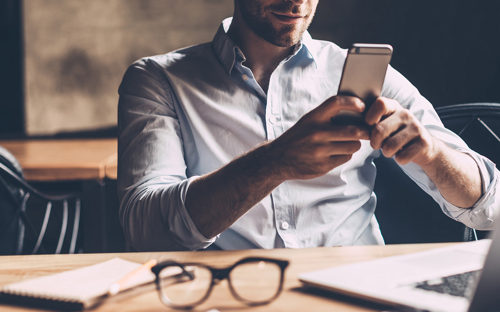 Businessman invoicing and bookkeeping at his desk