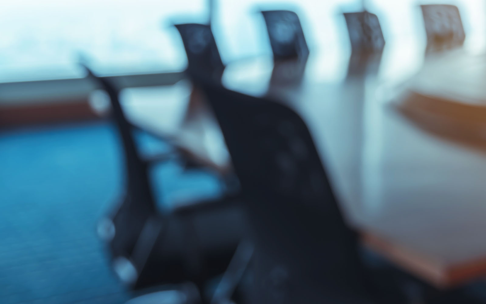 empty board room with chairs around a table