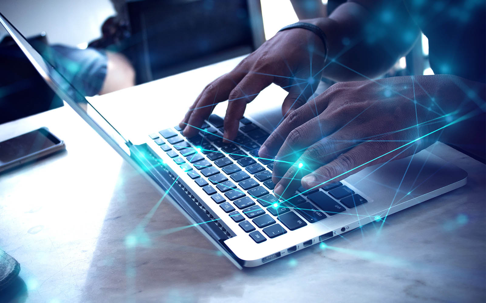 Person at laptop examining data.