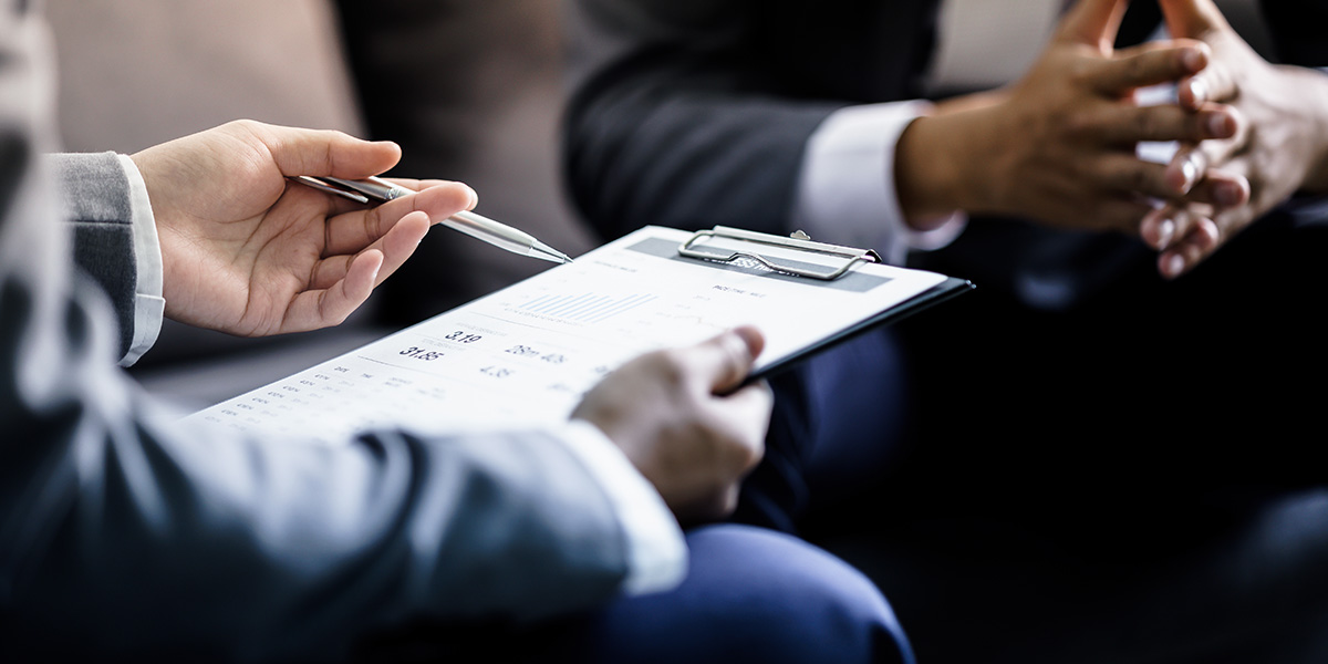 Two people discussing business