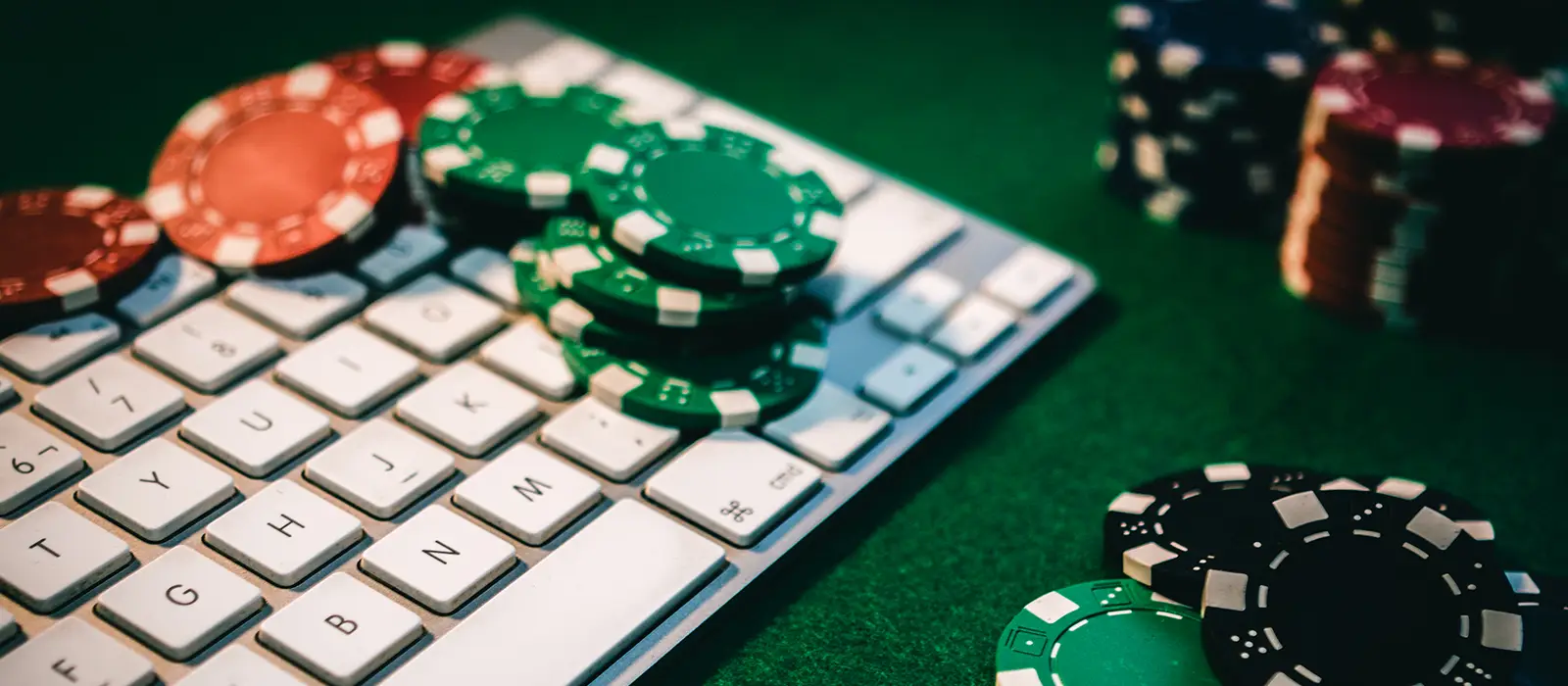 poker chips sitting on keyboard