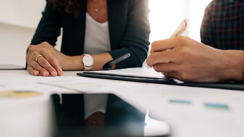 Businesswoman in a meeting with a colleague in office