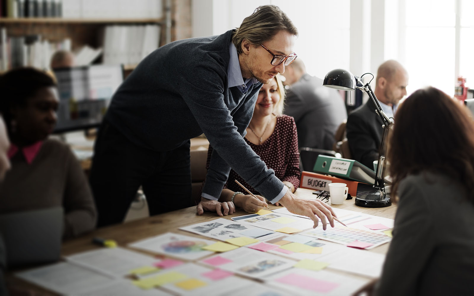 Business people discussing plans at a table