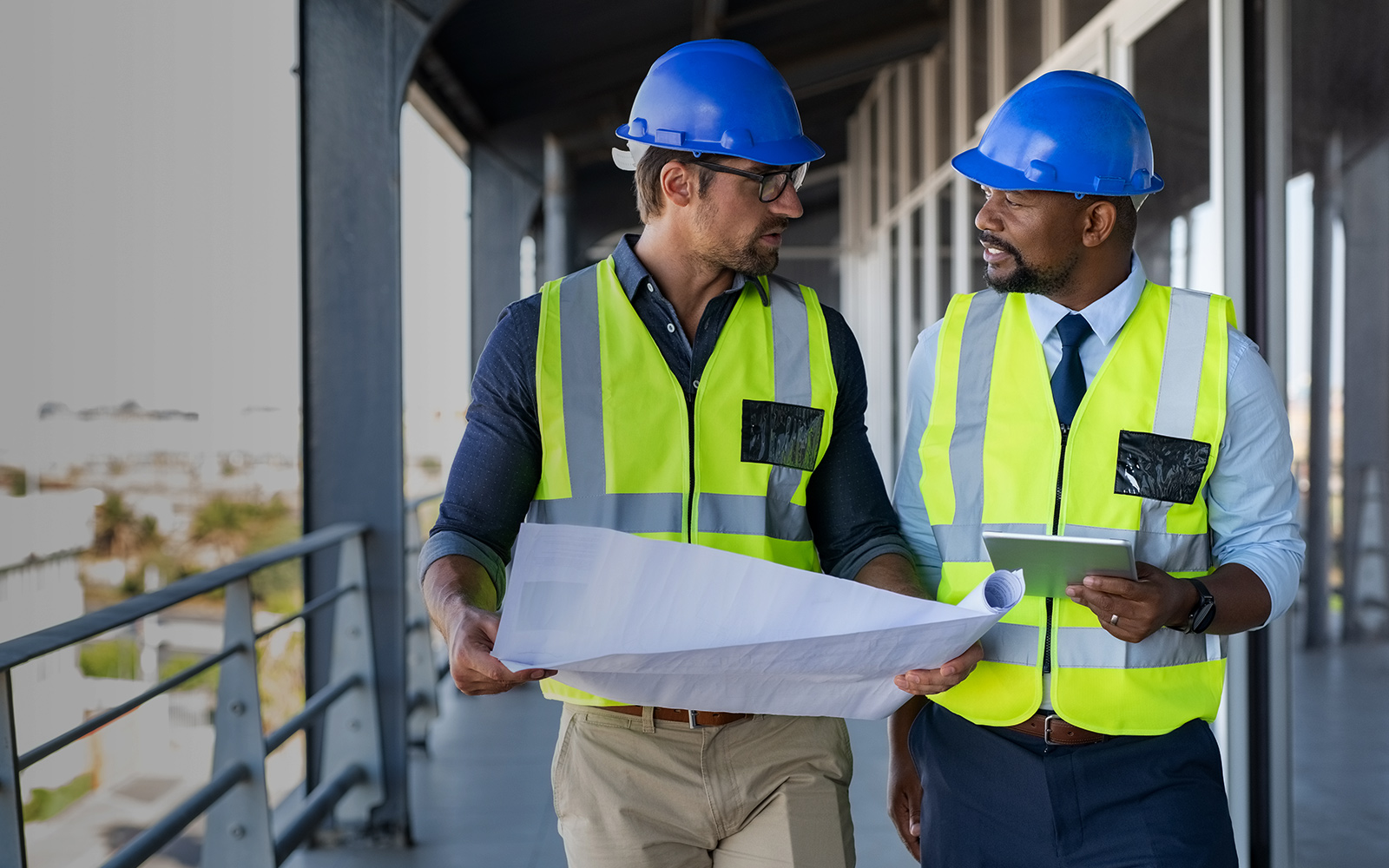 Architect-and-engineer-working-together-while-visiting-a-new-building