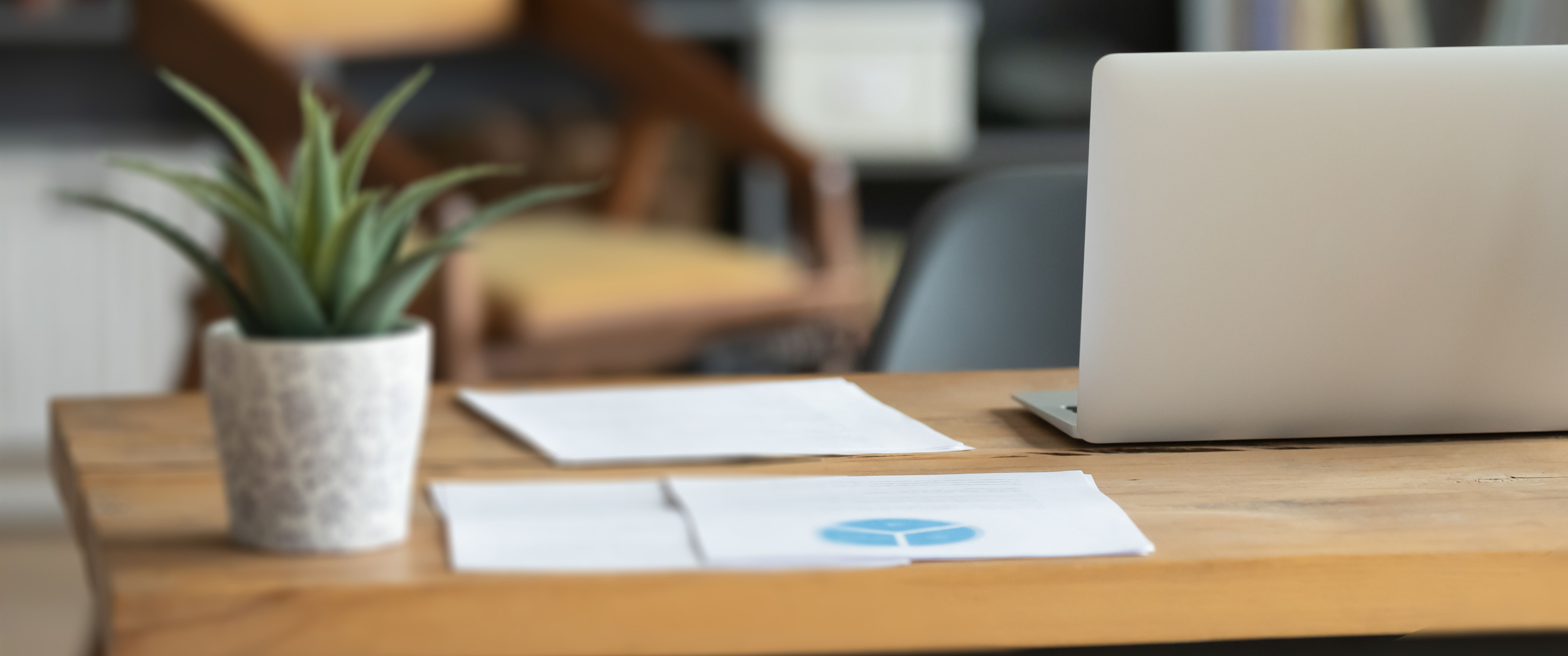 laptop sitting on a desk in a home office