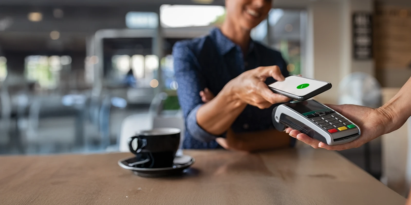 happy customer making a purchase at a restaurant