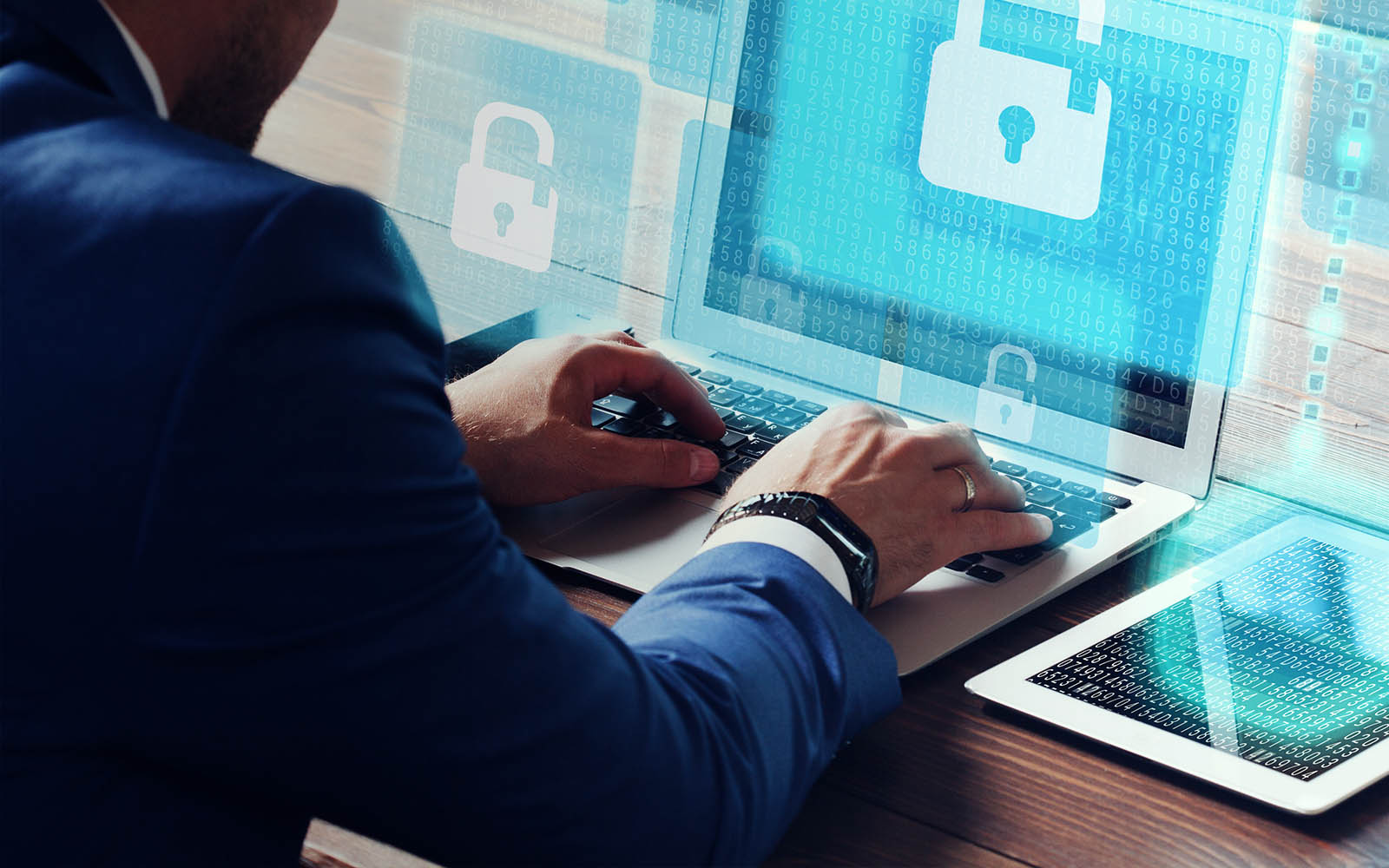 Businessman working on a laptop with a cyber securtiy icon overlaid