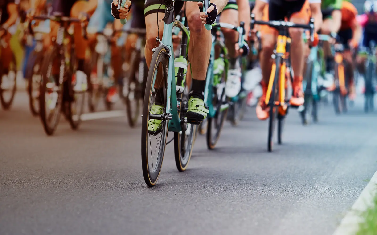 cyclists riding together on a road