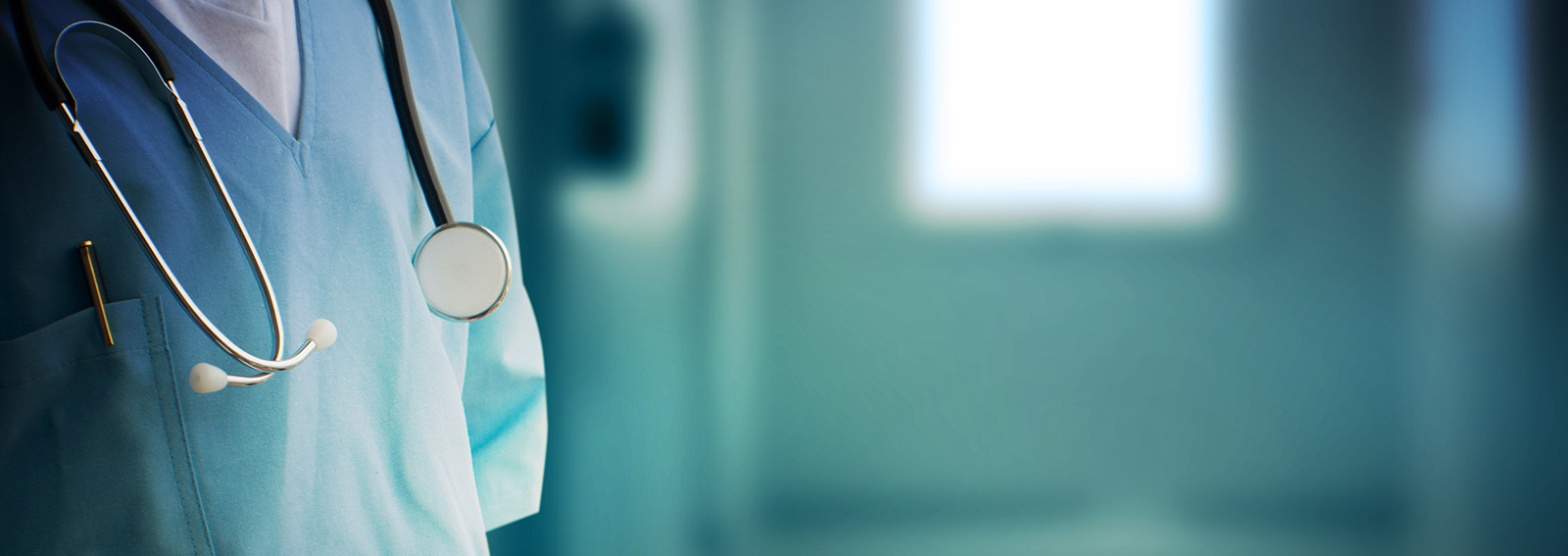 Close up of a stethoscope hung over a doctors shoulder