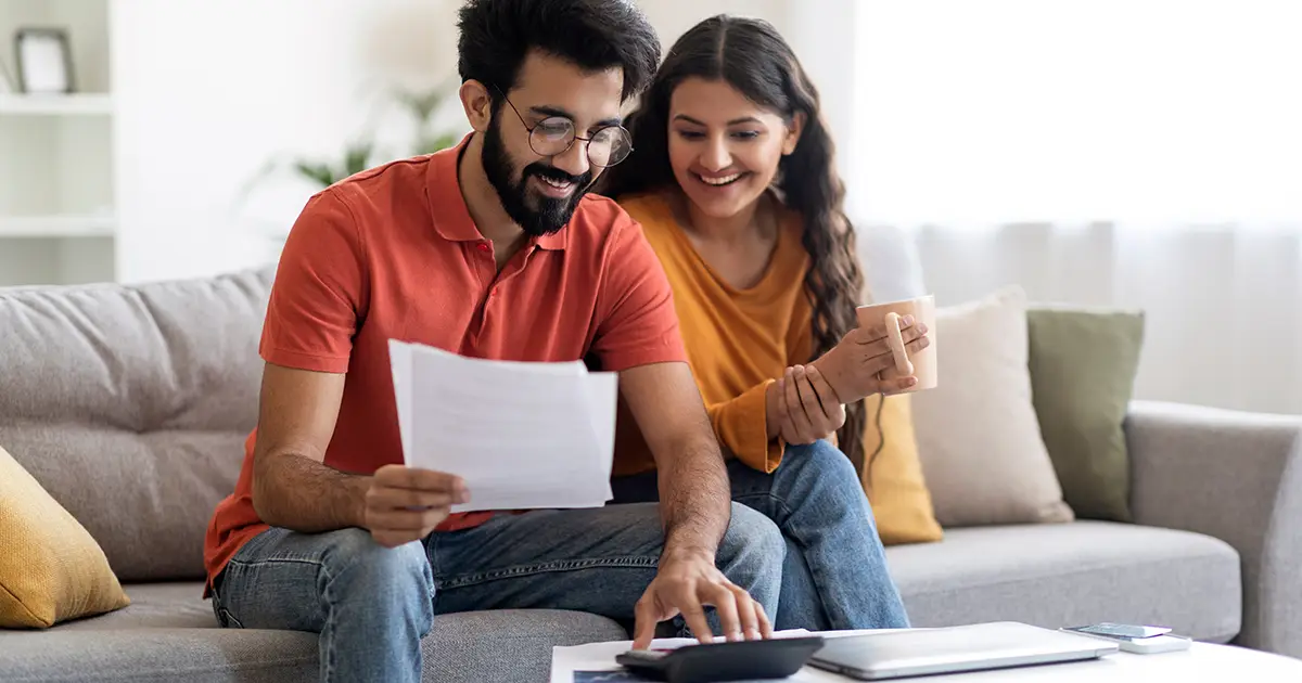 Checking Financial Documents And Calculating Family Budget At Home